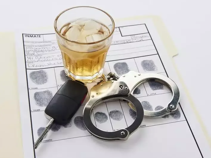 Car keys, alcohol, and handcuffs for DUI and DWI lawyers in Arkansas Car keys, alcohol, and handcuffs for DUI and DWI lawyers in Arkansas