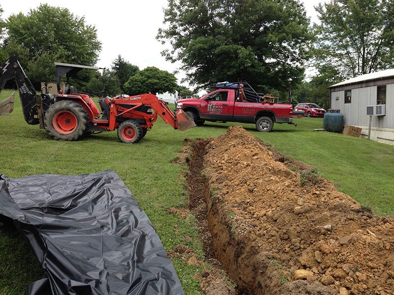 Backhoe Digging Water Line