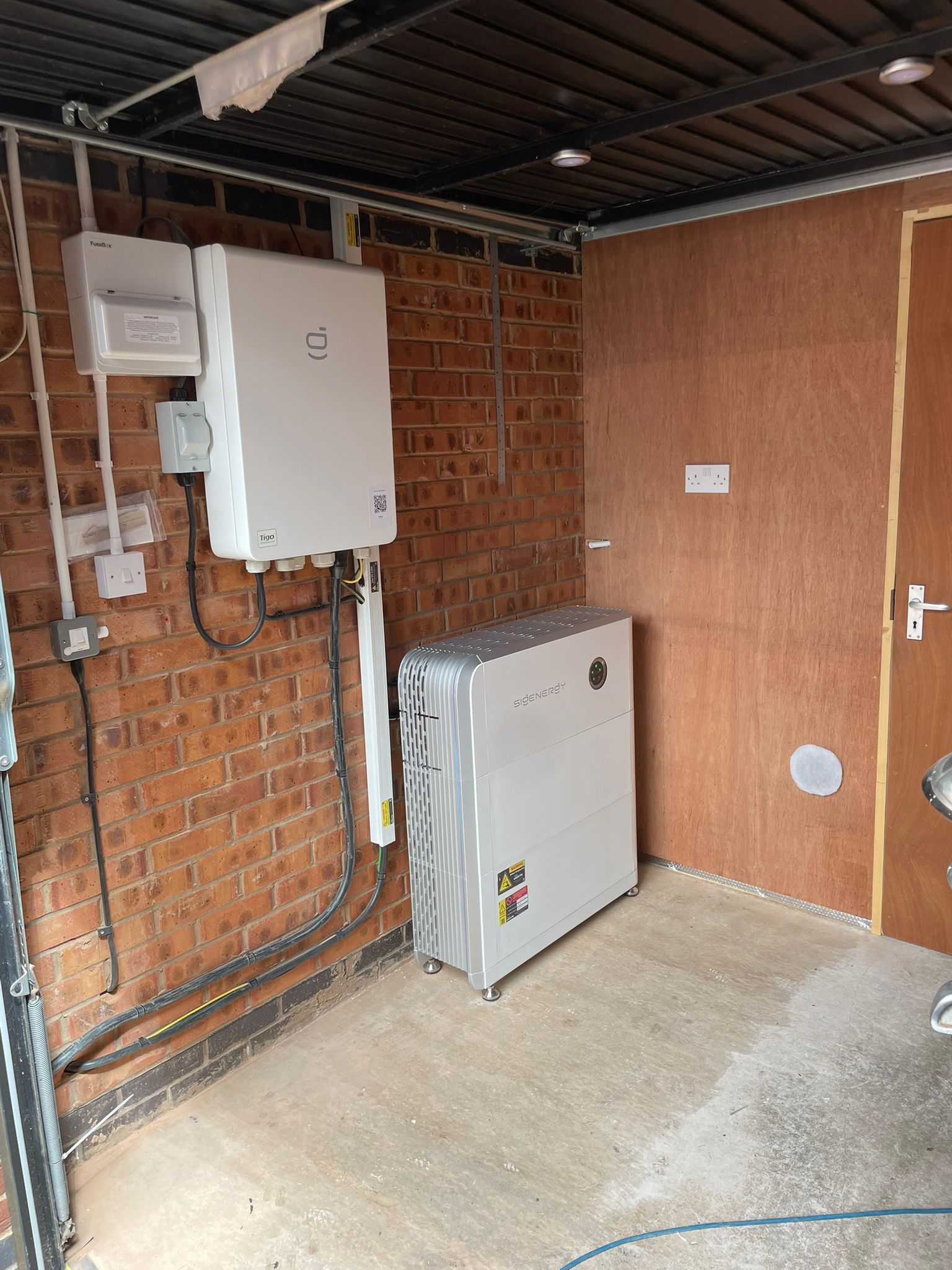 Solar panel equipment installed on brick and wood walls.