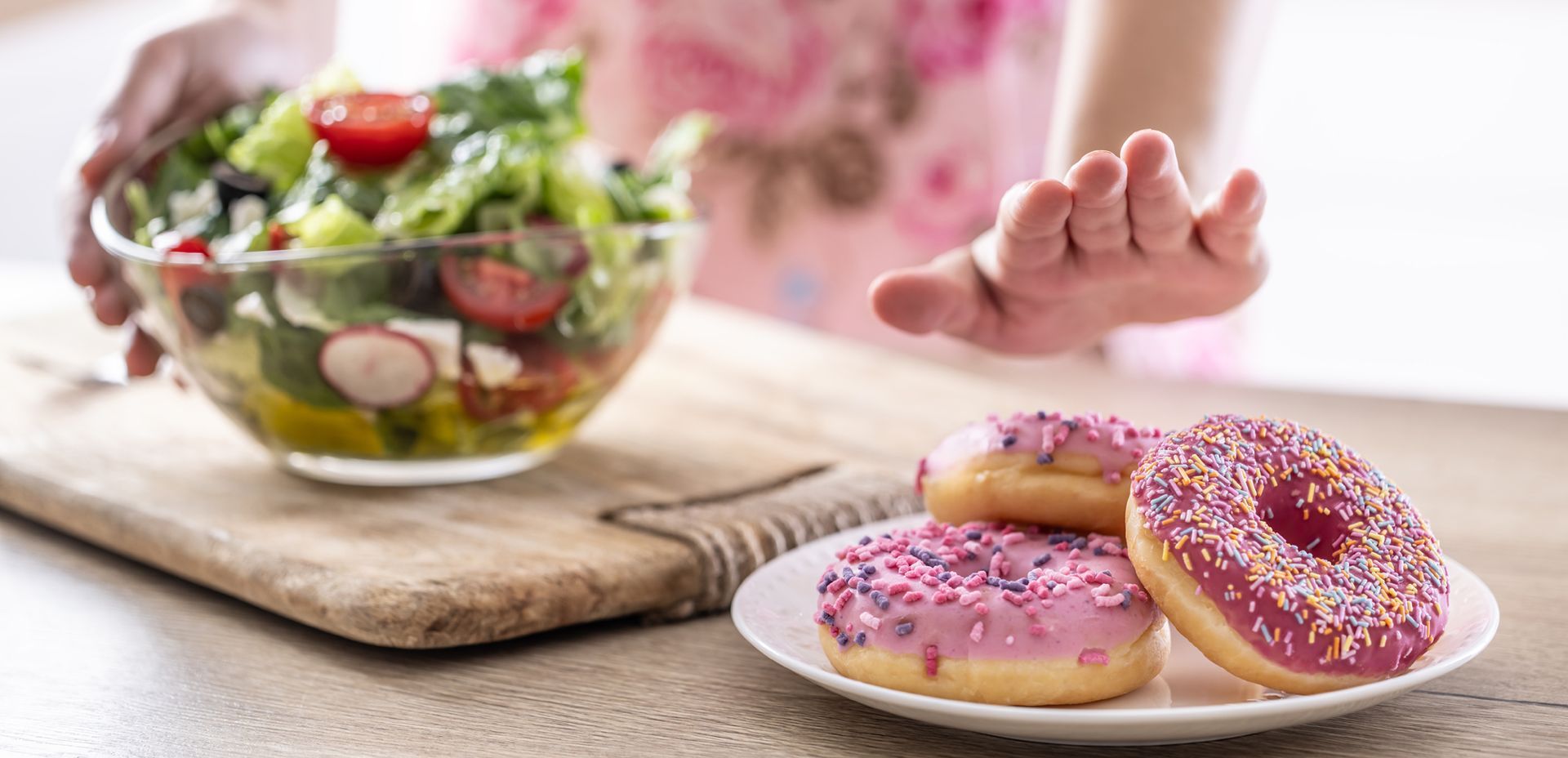 woman passing on a donut during her 10-Day Sugar Cleanse.