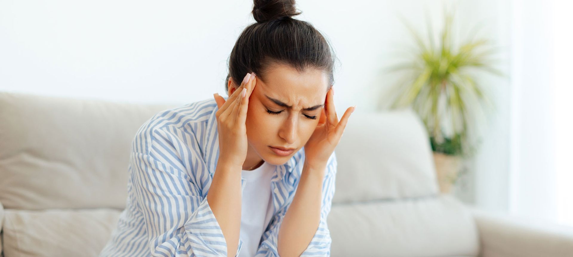 Woman rubbing her head. Natural Headache Relief. Holistic Relief for Headaches: Effective Techniques to Alleviate Pain Naturally