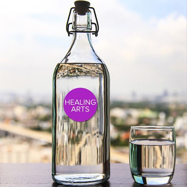 Clear glass bottle and glass of water with a 