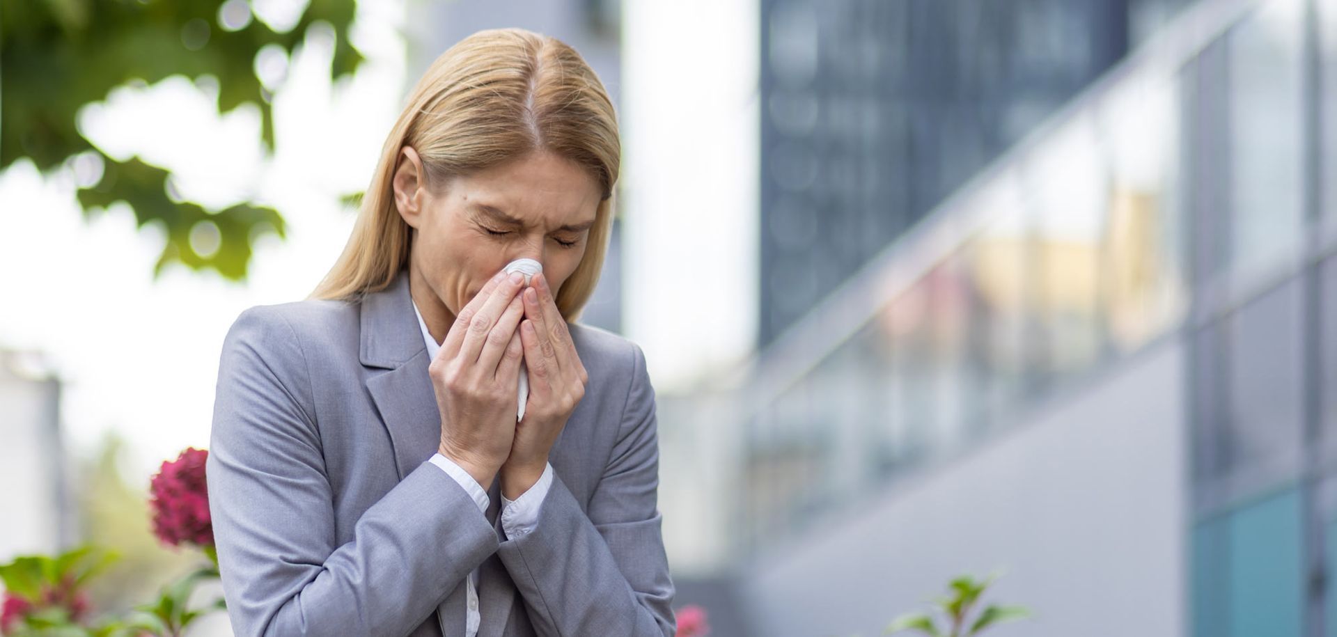 Woman with allergy sneezing. Relief from Seasonal Allergies
