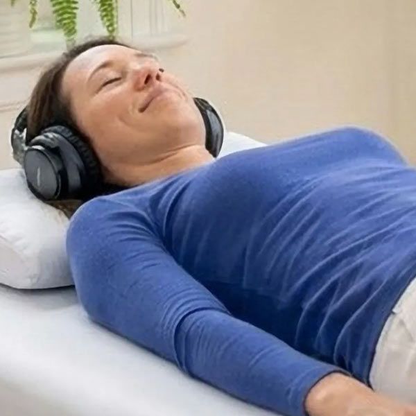 Dr Alicia Armitstead demonstrates a Vibroacoustic Therapy