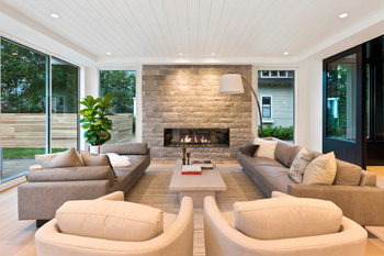 A living room filled with furniture and a fireplace