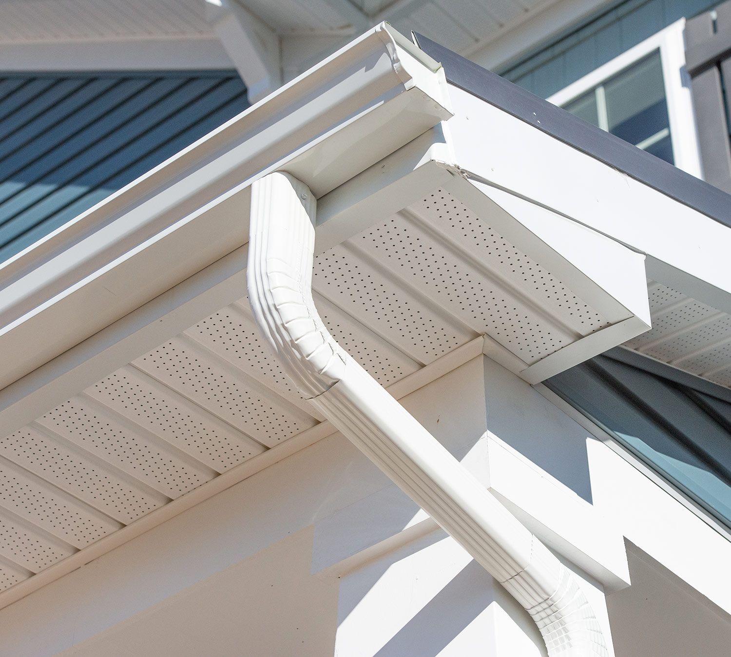 White house with gutter and downspout