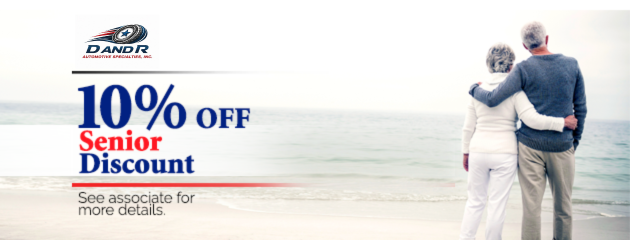 10% off senior discount ad with a couple standing on a beach at sunset