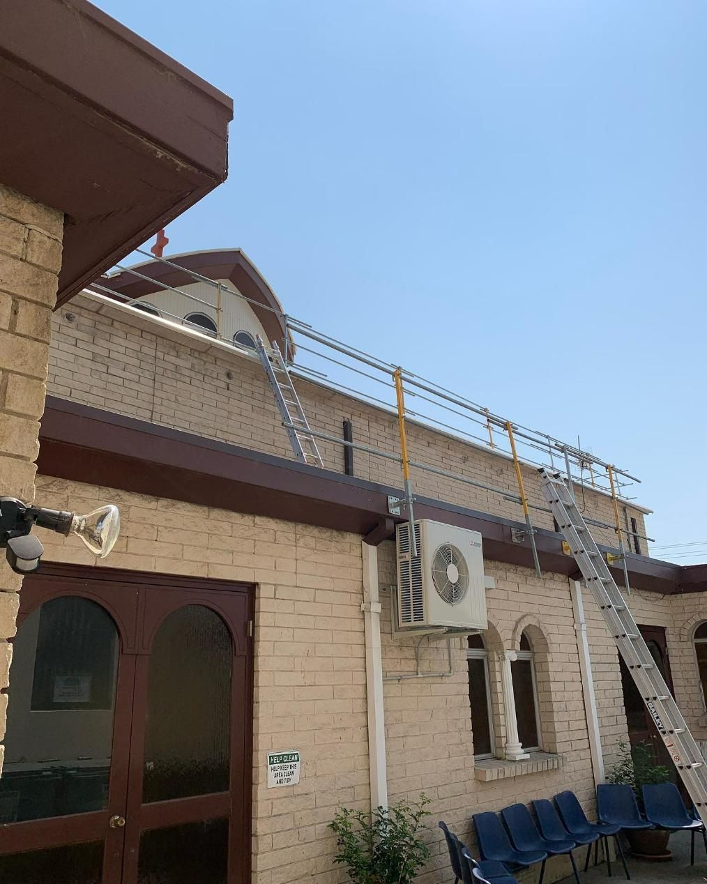 There Is a Ladder on The Roof of A Building  — Site Safety NSW in port Stephens, NSW