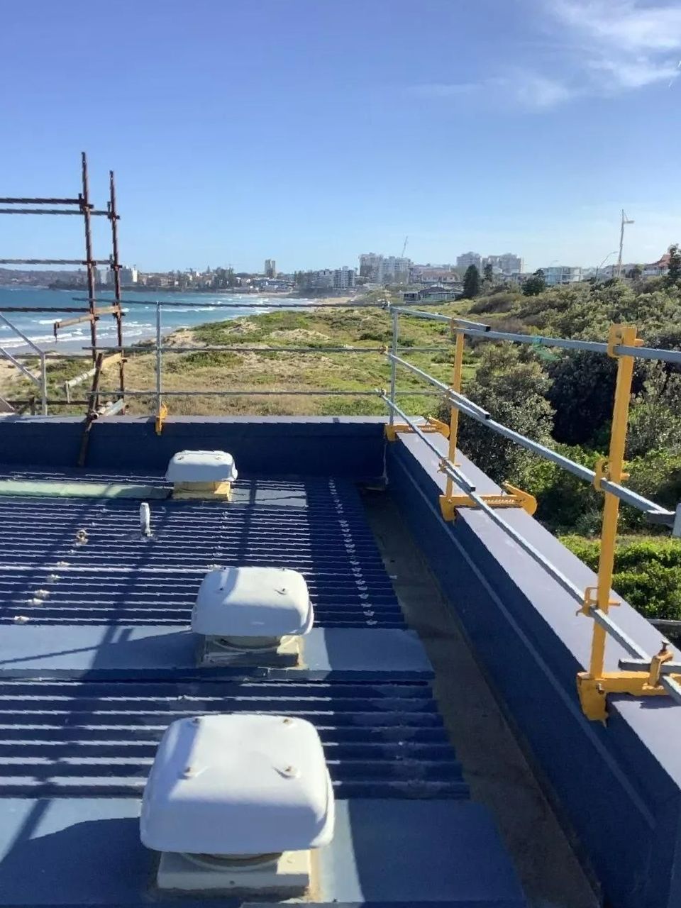 The Roof of A Building with A View of The Ocean — Site Safety NSW in Sandgate, NSW