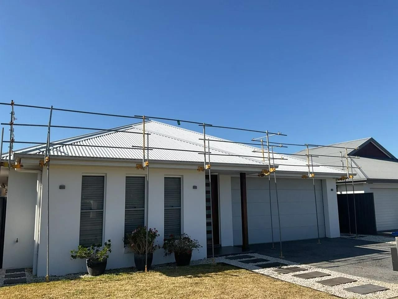 A White House with A Blue Sky in The Background — Site Safety NSW in Sandgate, NSW