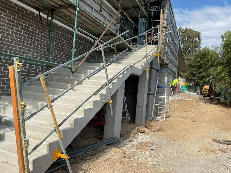 A Staircase Is Being Built on The Side of A Building — Site Safety NSW in Sandgate, NSW