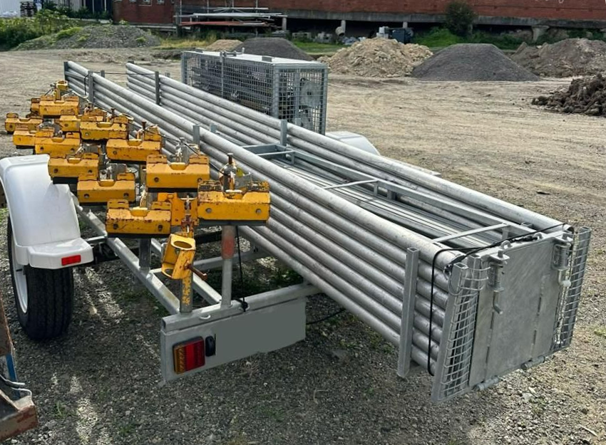 A Trailer with A Bunch of Metal Pipes on It — Site Safety NSW in Sandgate, NSW