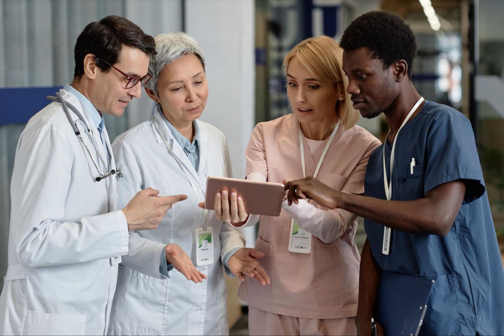 A group of healthcare providers using Meditab’s IMS EHR to track and manage MIPS measures effectively.
