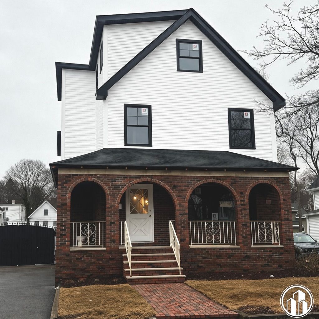 Two-story house with white siding and brick porch, front steps, and arched entryways on a cloudy day