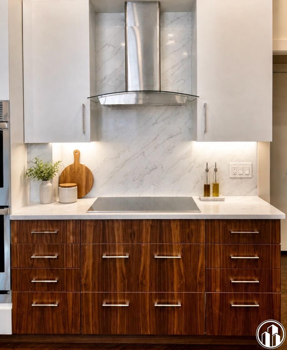 Modern kitchen with white marble backsplash, stainless hood, and dark wood cabinets