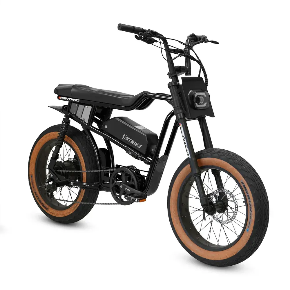 Black electric bicycle with tan tires and a large, padded seat.