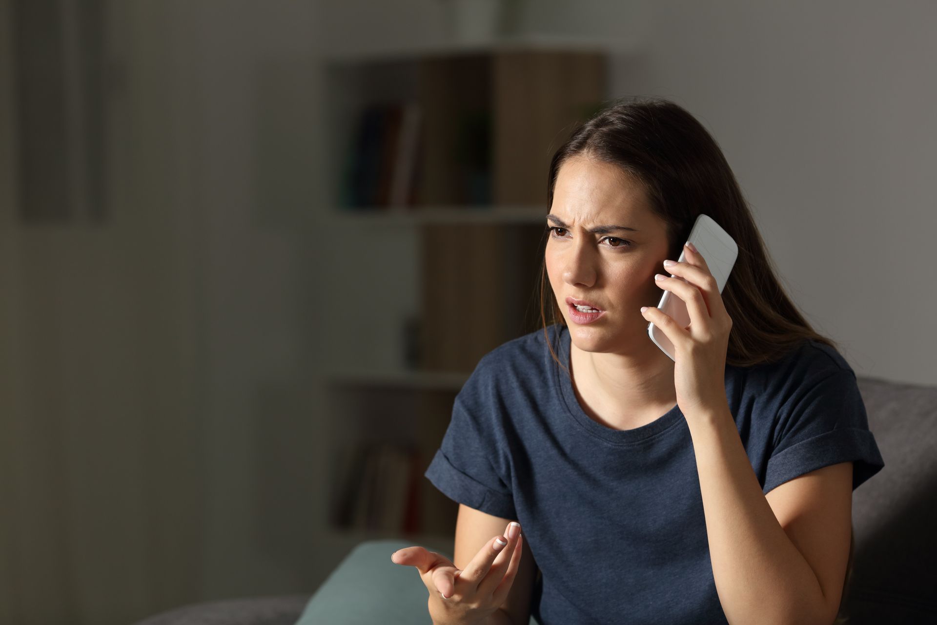A woman talking on the phone at night