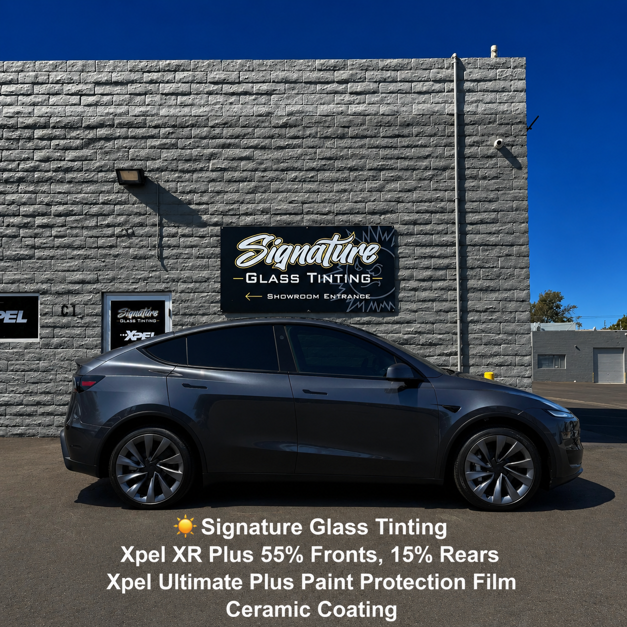 Black luxury SUV outside Signature Glass Tinting shop with service text overlay