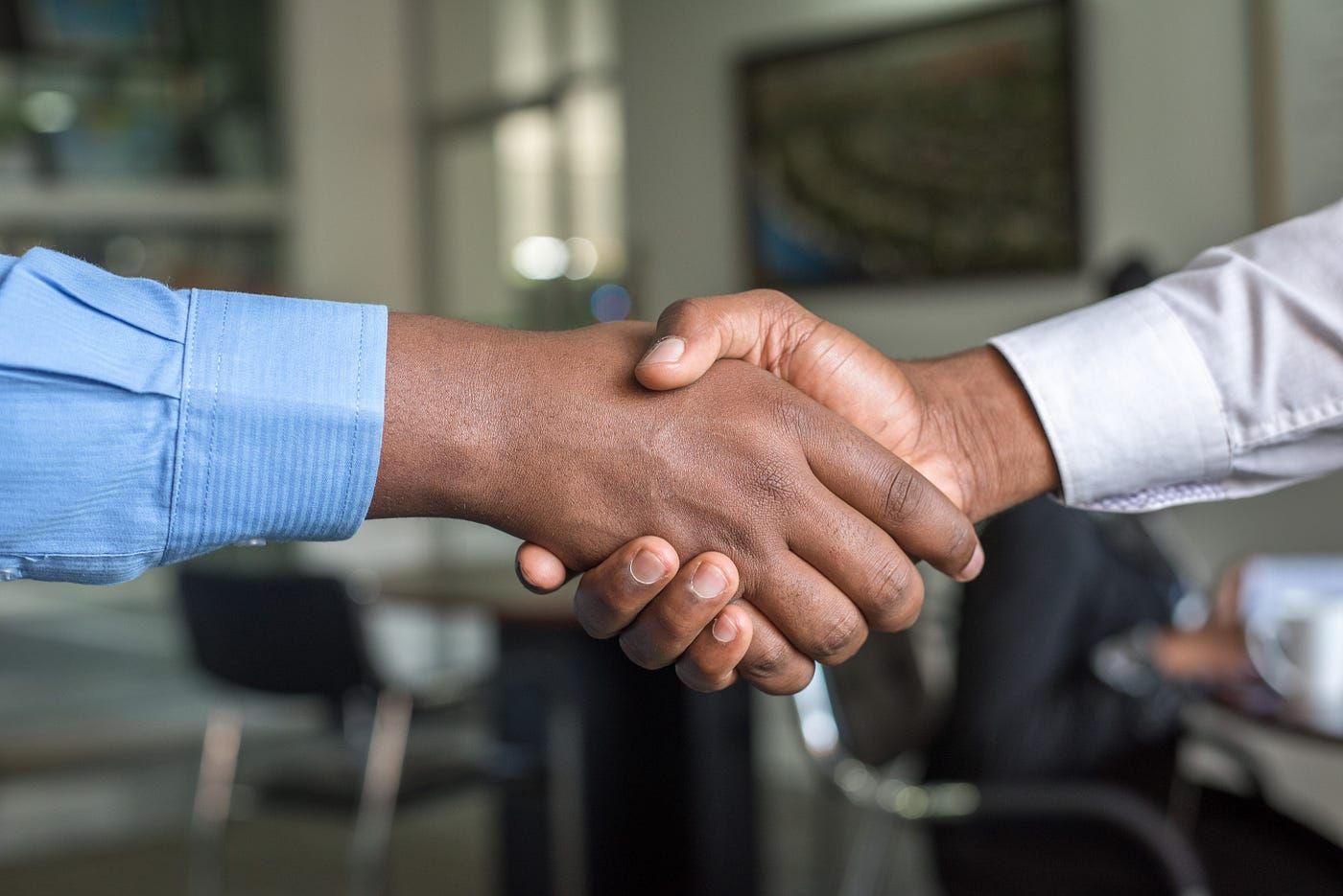 close-up handshake between an attorney and a client
