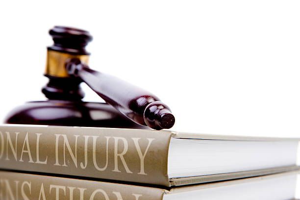 image of law injury with the gavel and a book of law