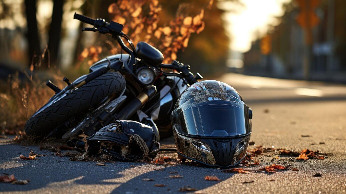 damaged motorcycle from an accident on the side of the road