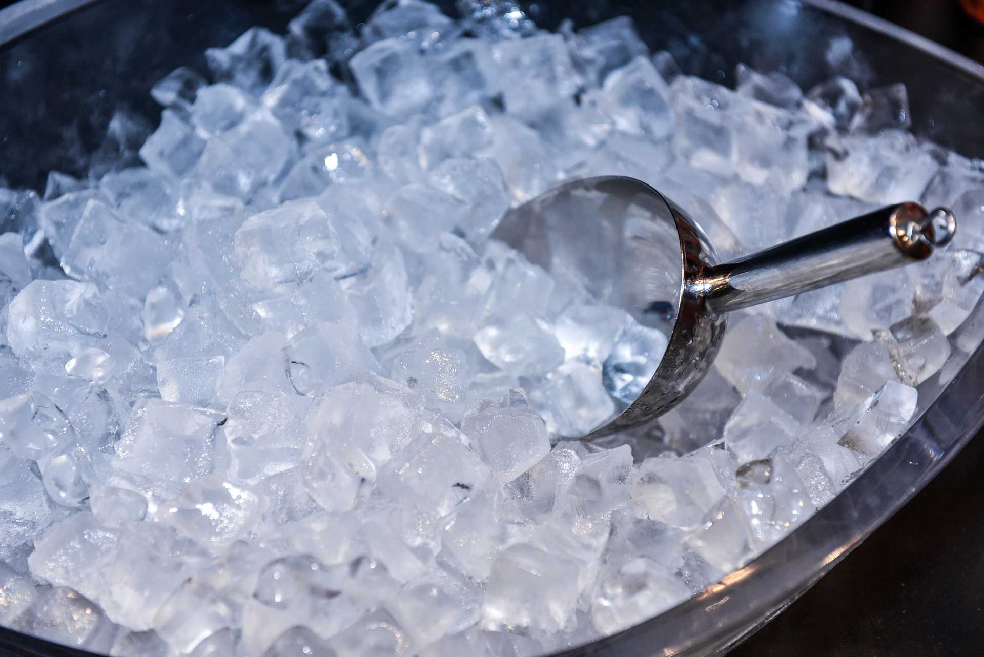 Iced scoop in bucket, highlighting fresh ice, provided by a reliable ice supplier for events. Iced scoop in bucket, highlighting fresh ice, provided by a reliable ice supplier for events.