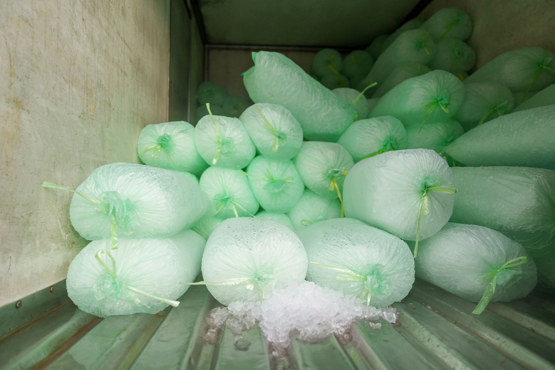 Plastic bags filled with ice cubes for sale inside a commercial.