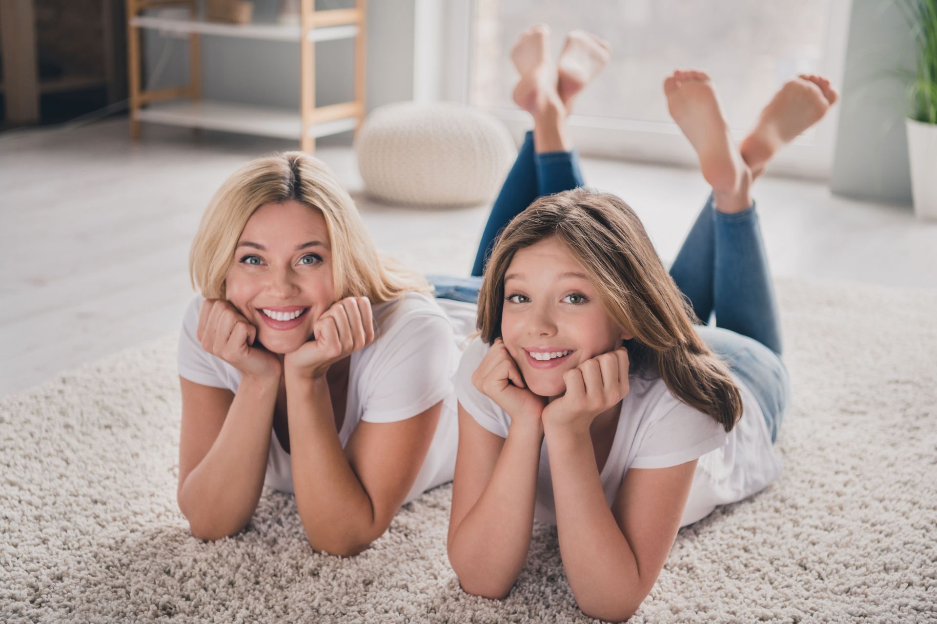 mother and daughter on a carpet