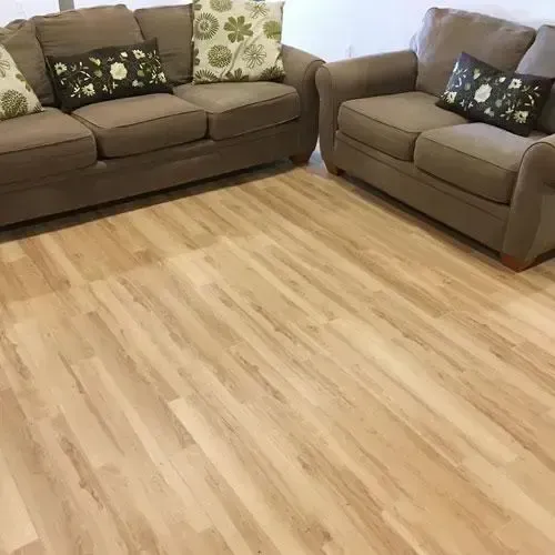 Pasco living room with light colored hardwood flooring