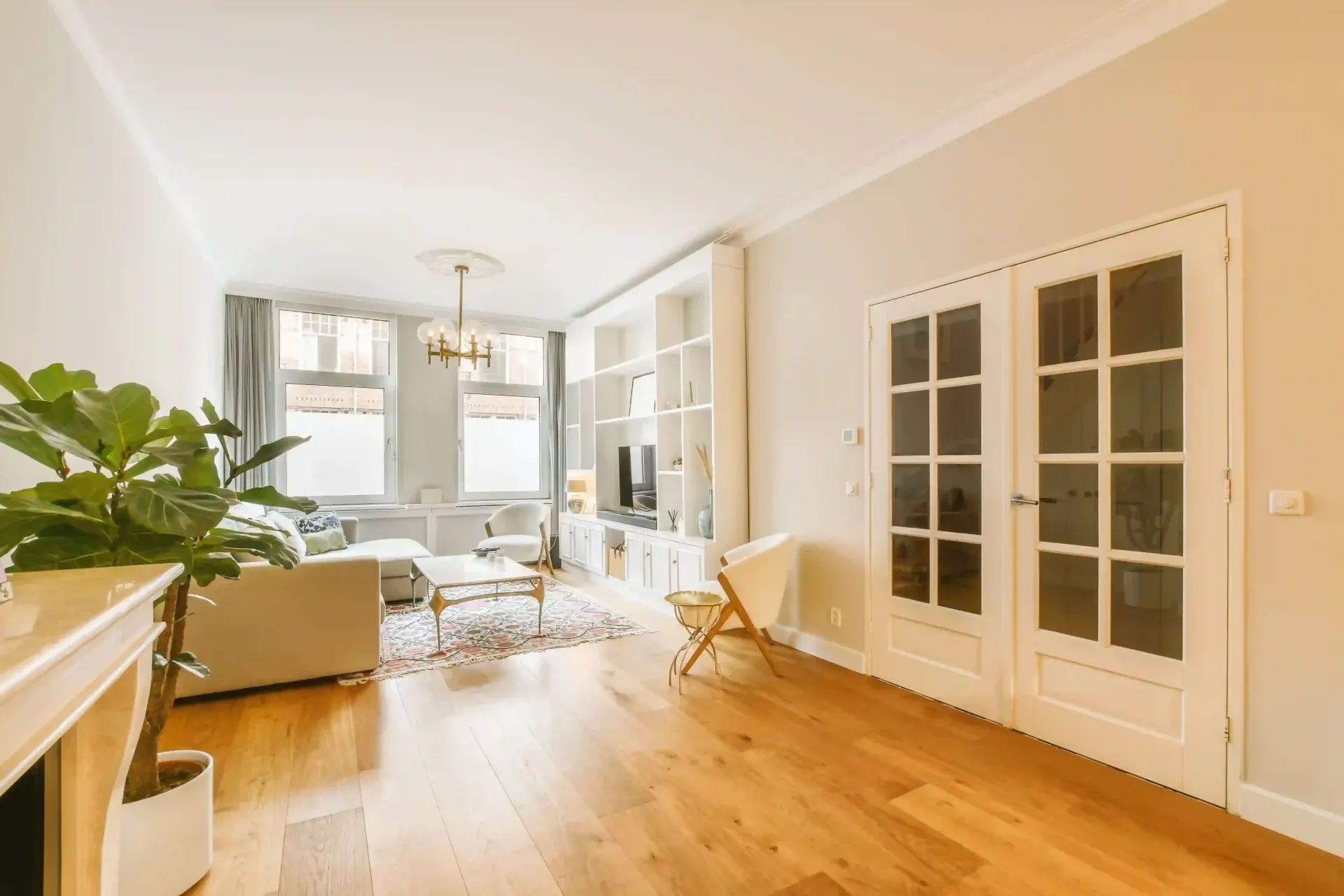 A living room with gorgeous light colored hardwood floors in Yakima, WA