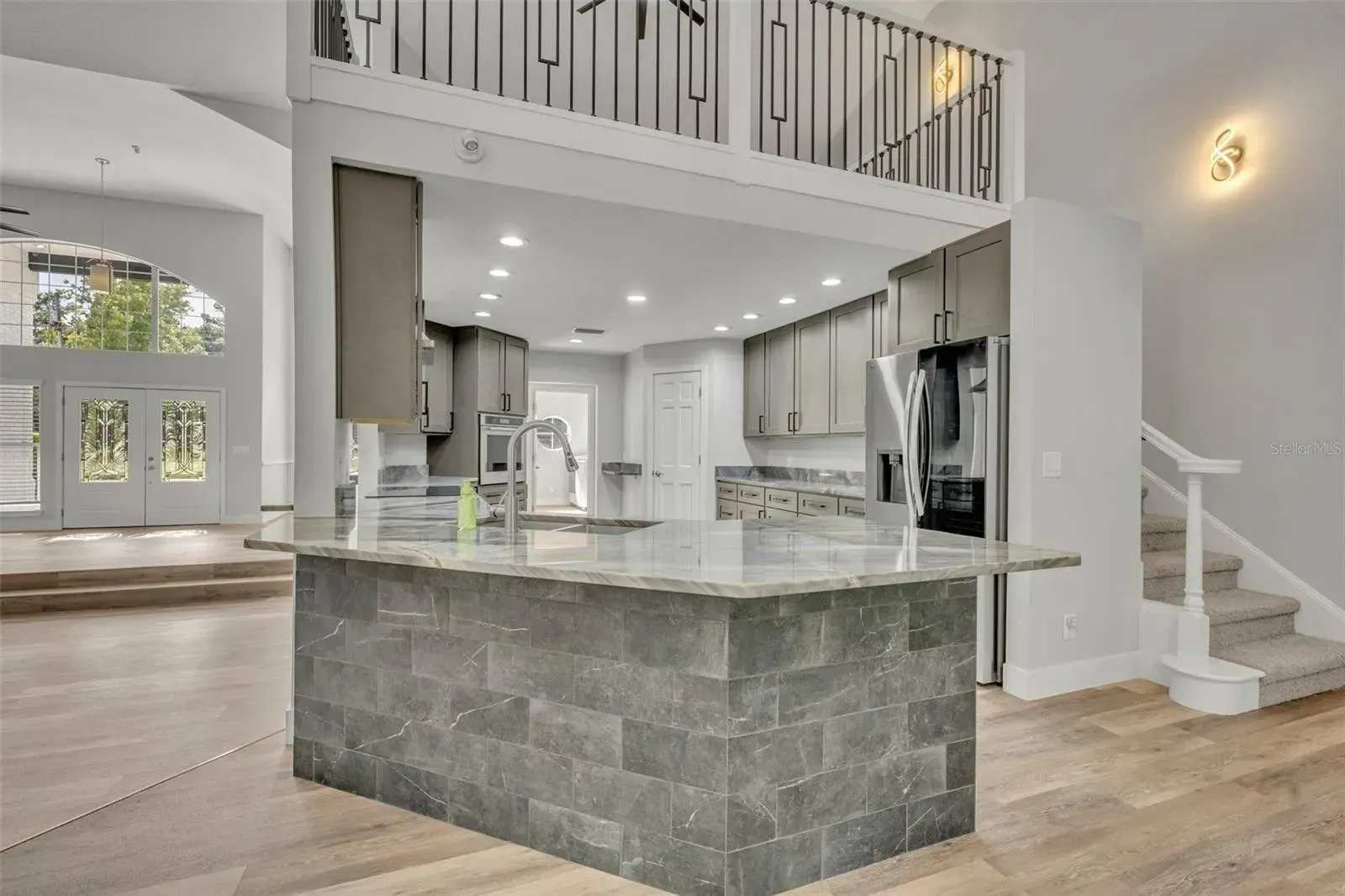 There is a large island in the middle of the kitchen.