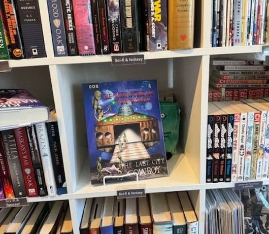 A bookshelf display featuring a highlighted copy of the book 