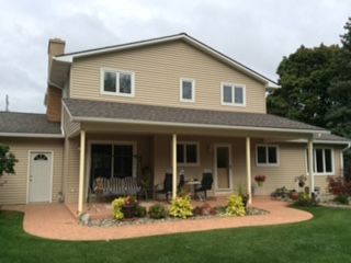 Roof and siding of a beige house