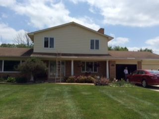 Suburban house with beige siding