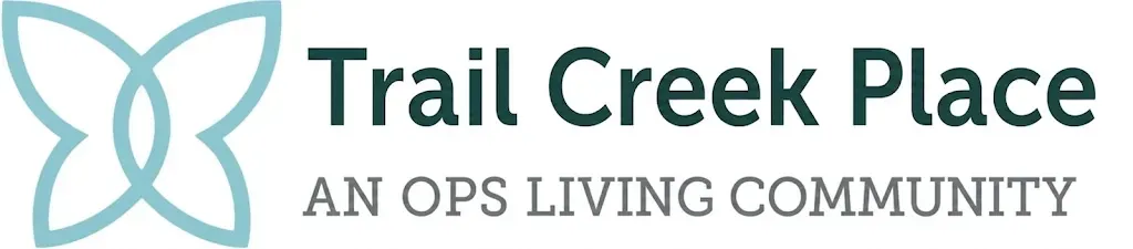 Trail Creek Place logo with teal abstract flower icon and gray text