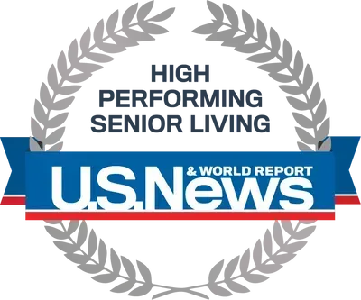 U.S. News badge reading “High Performing Senior Living” with laurel wreath and blue banner