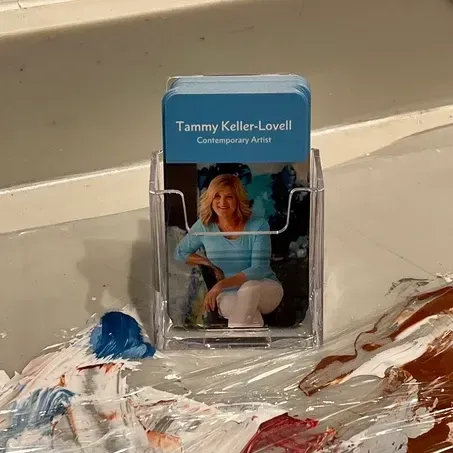 Business card holder with cards that read 