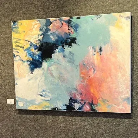 Abstract painting on canvas, colorful brushstrokes, blues, pinks, yellows, and white.