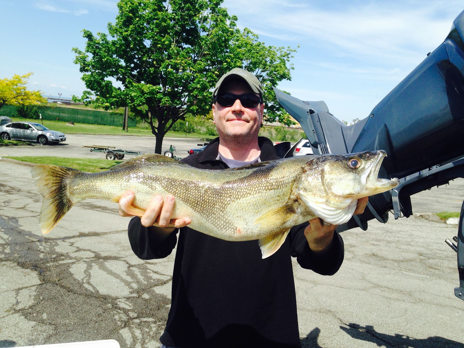 Captain Chuck Holding Fish