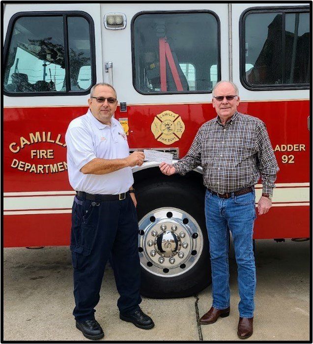L-R: Jamie Sullivan, Bill Bullard On behalf of the Southwest Georgia Fire Chief’s Association, City of Camilla Fire Chief Jamie Sullivan presents Peanut Proud team member Bill Bullard of Birdsong Peanuts a check for the Kentucky Tornado Relief effort. L-R: Jamie Sullivan, Bill Bullard On behalf of the Southwest Georgia Fire Chief’s Association, City of Camilla Fire Chief Jamie Sullivan presents Peanut Proud team member Bill Bullard of Birdsong Peanuts a check for the Kentucky Tornado Relief effort.