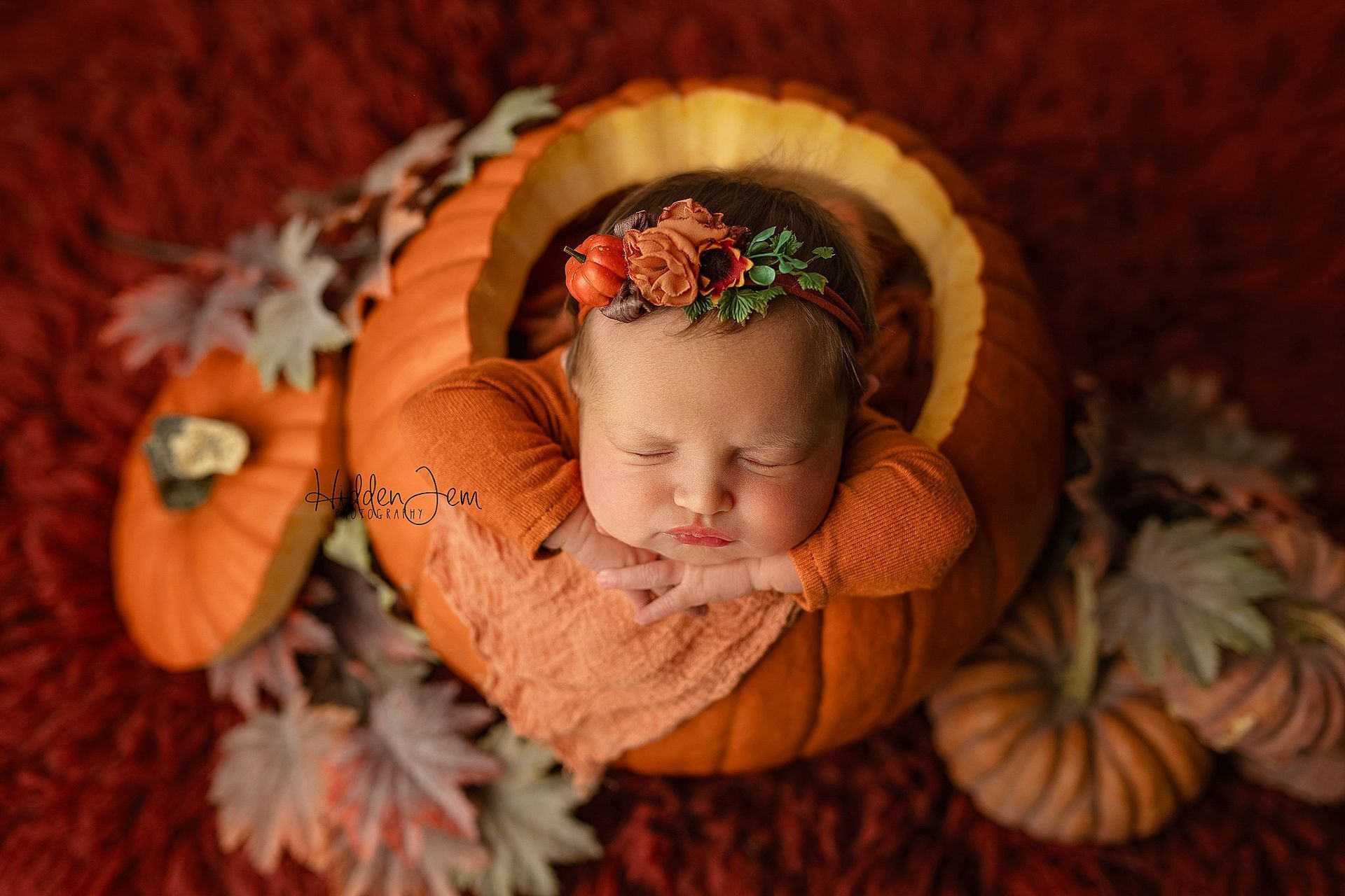 baby in a pumpkin