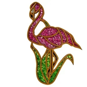 Pink glitter flamingo with green leaves, outlined in gold on a white background