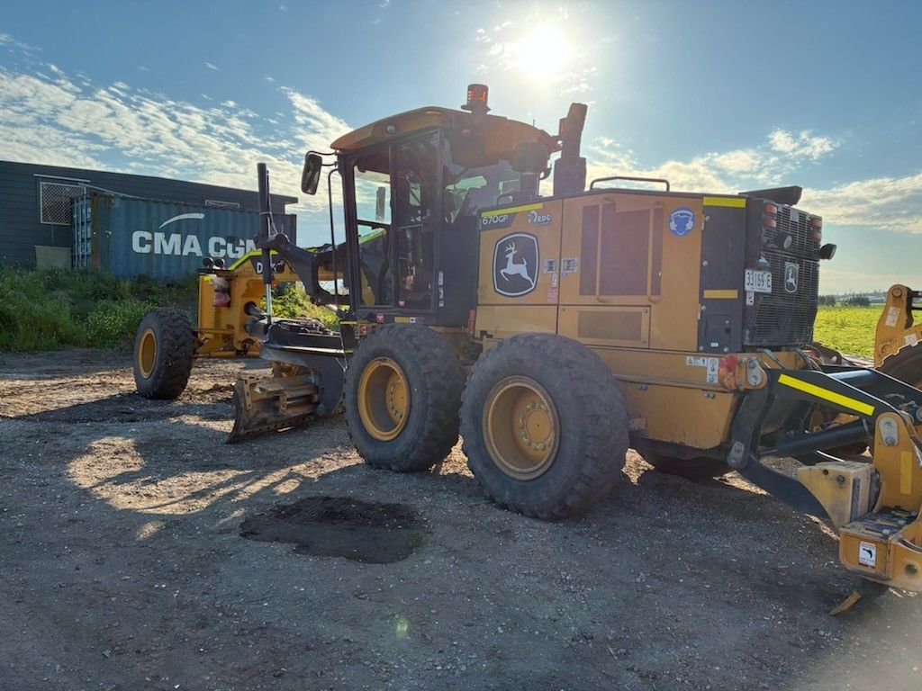 A Yellow and Black Tractor is Sitting on Top of a Dirt Field — Lantry Earthmoving in Phoenix Park, NSW