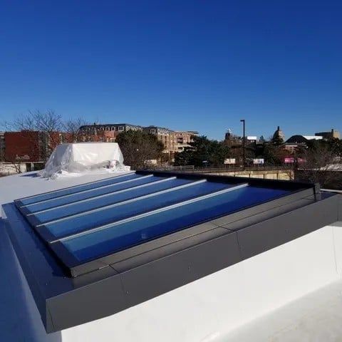 There is a skylight on the roof of a building.