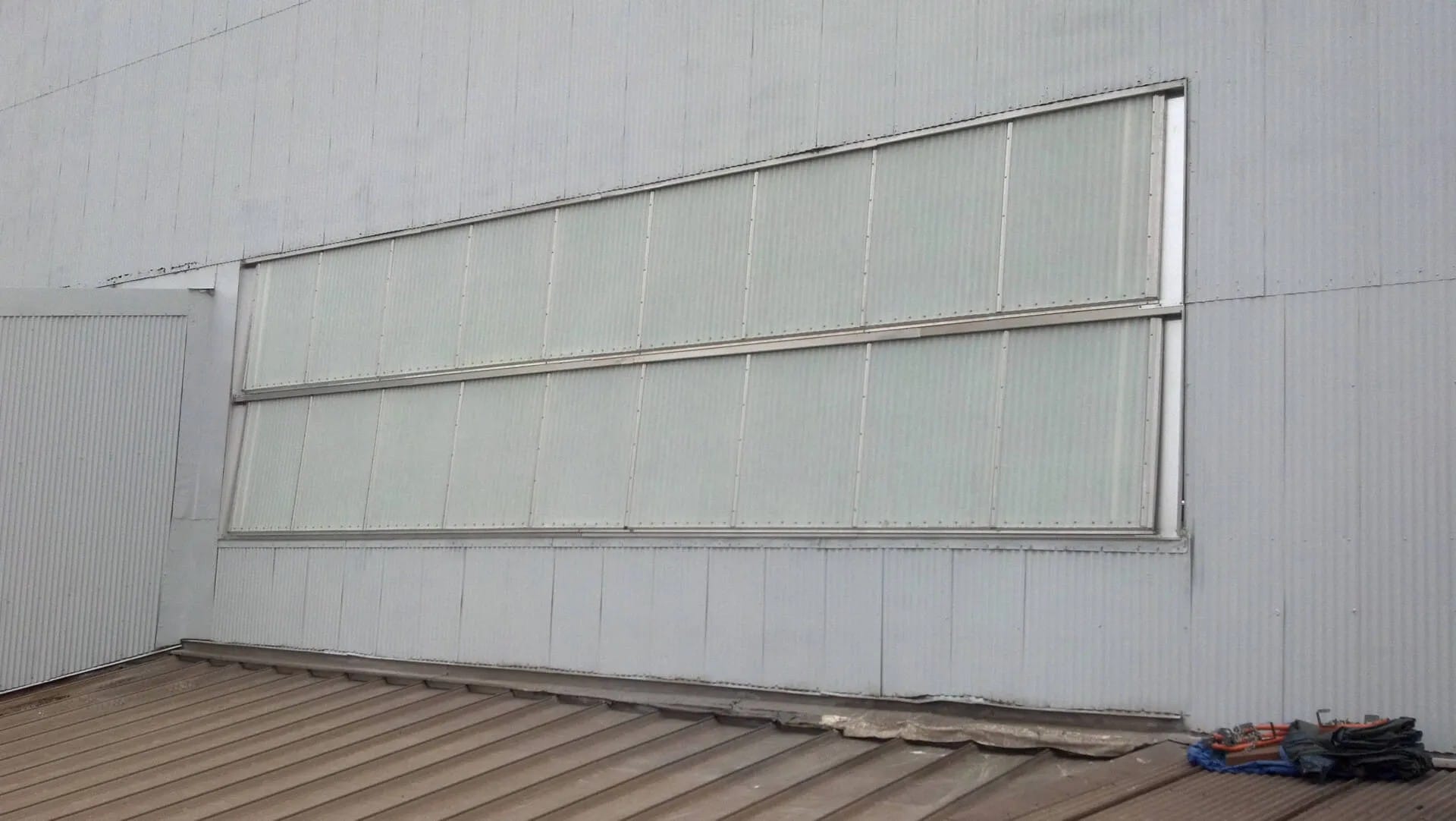 There is a window on the side of a building.