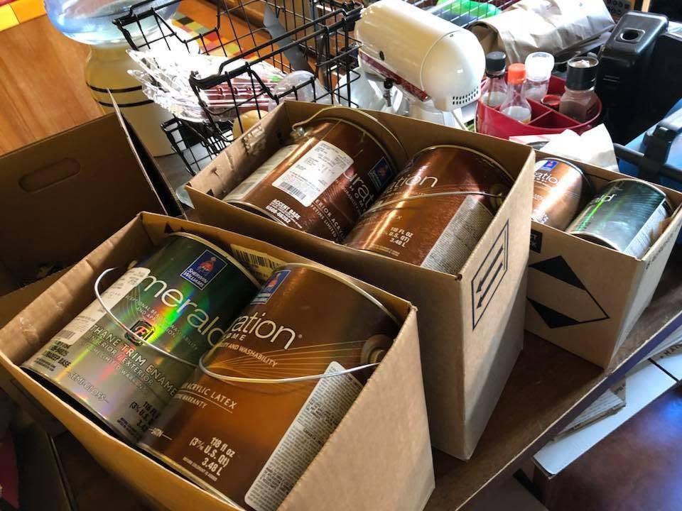 Boxed bath products displayed on a table in a store or stockroom
