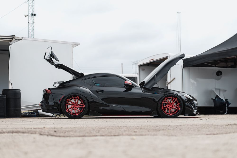 A Black Sports Car With the Hood Up is Parked in a Parking Lot — Mick Dunn Motor Repairs in Mackay, QLD
