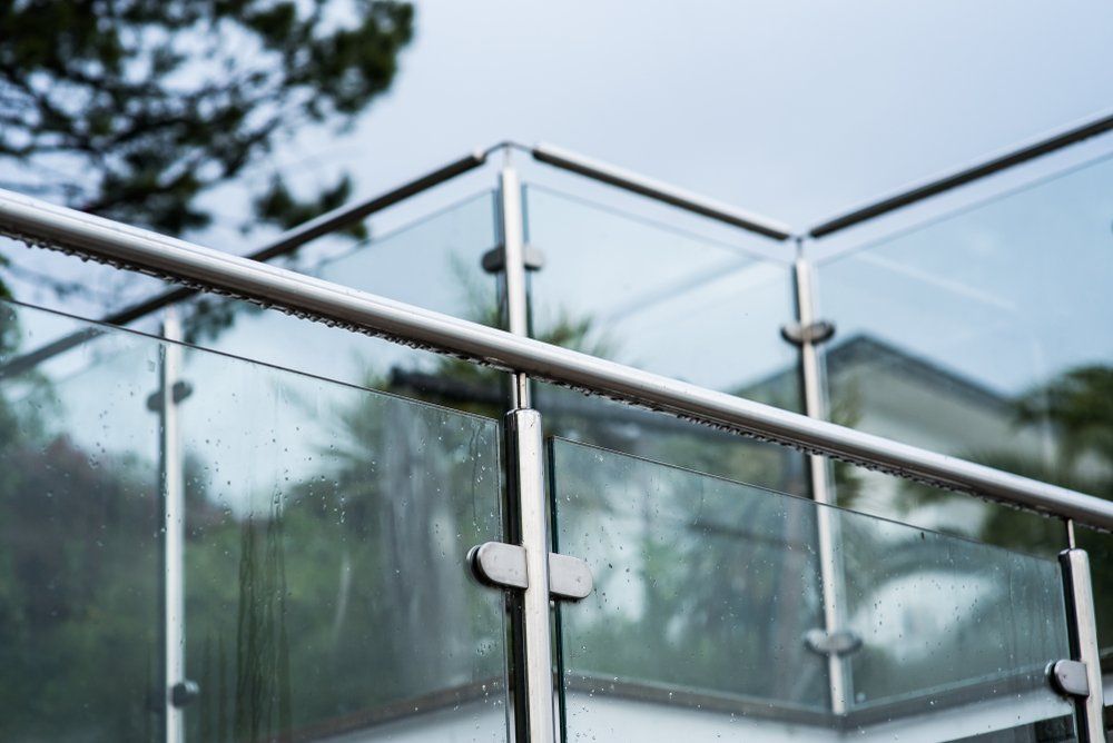 A Close up Of a Glass Railing on A Balcony — Coastline Glass Pool Fencing in Smiths Lake, NSW