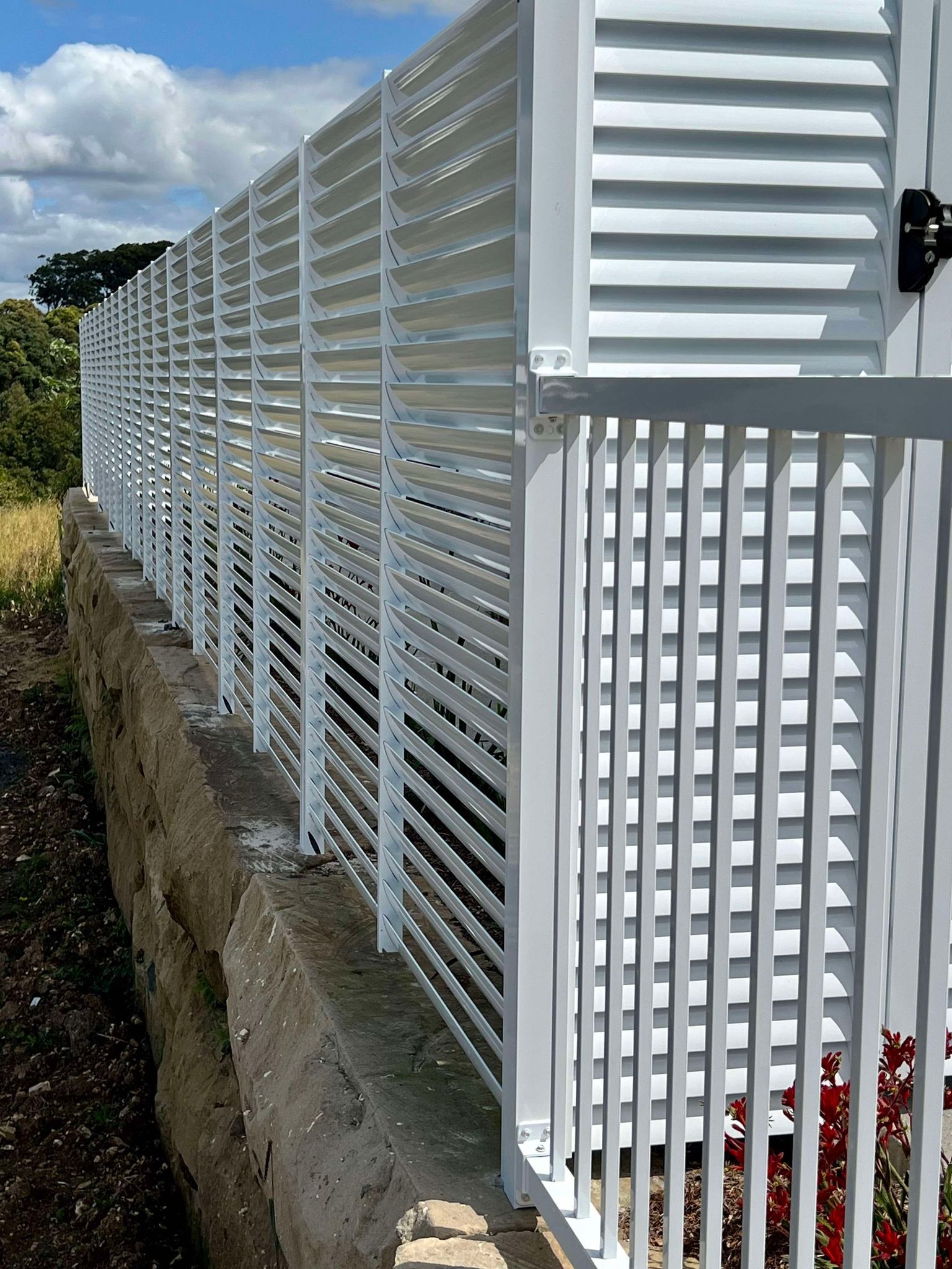 A White Fence with Shutters on It — Coastline Glass Pool Fencing in Old Bar, NSW