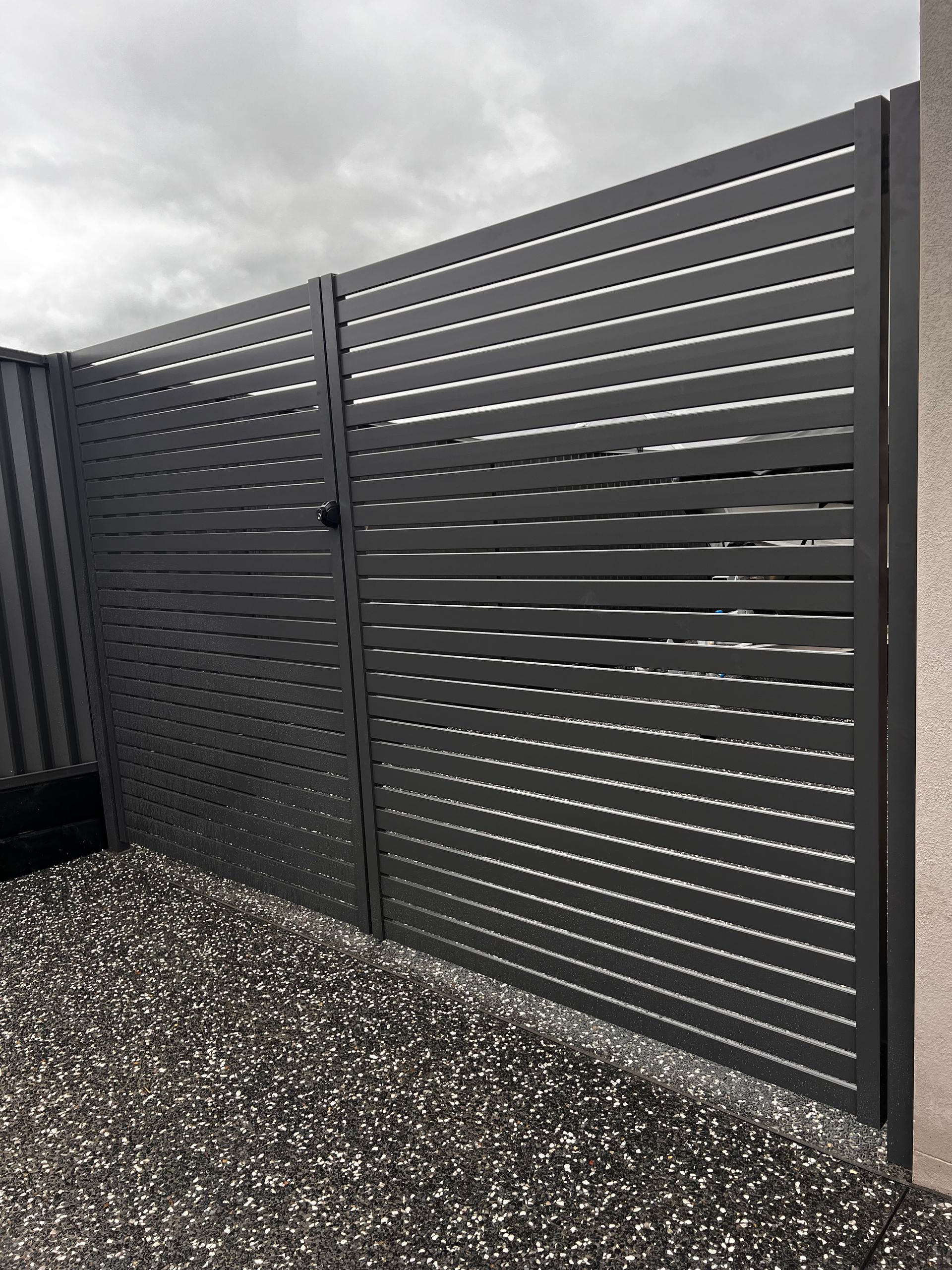 Dark Grey Metal Privacy Gate with Horizontal Slats — Coastline Glass Pool Fencing in Old Bar, NSW